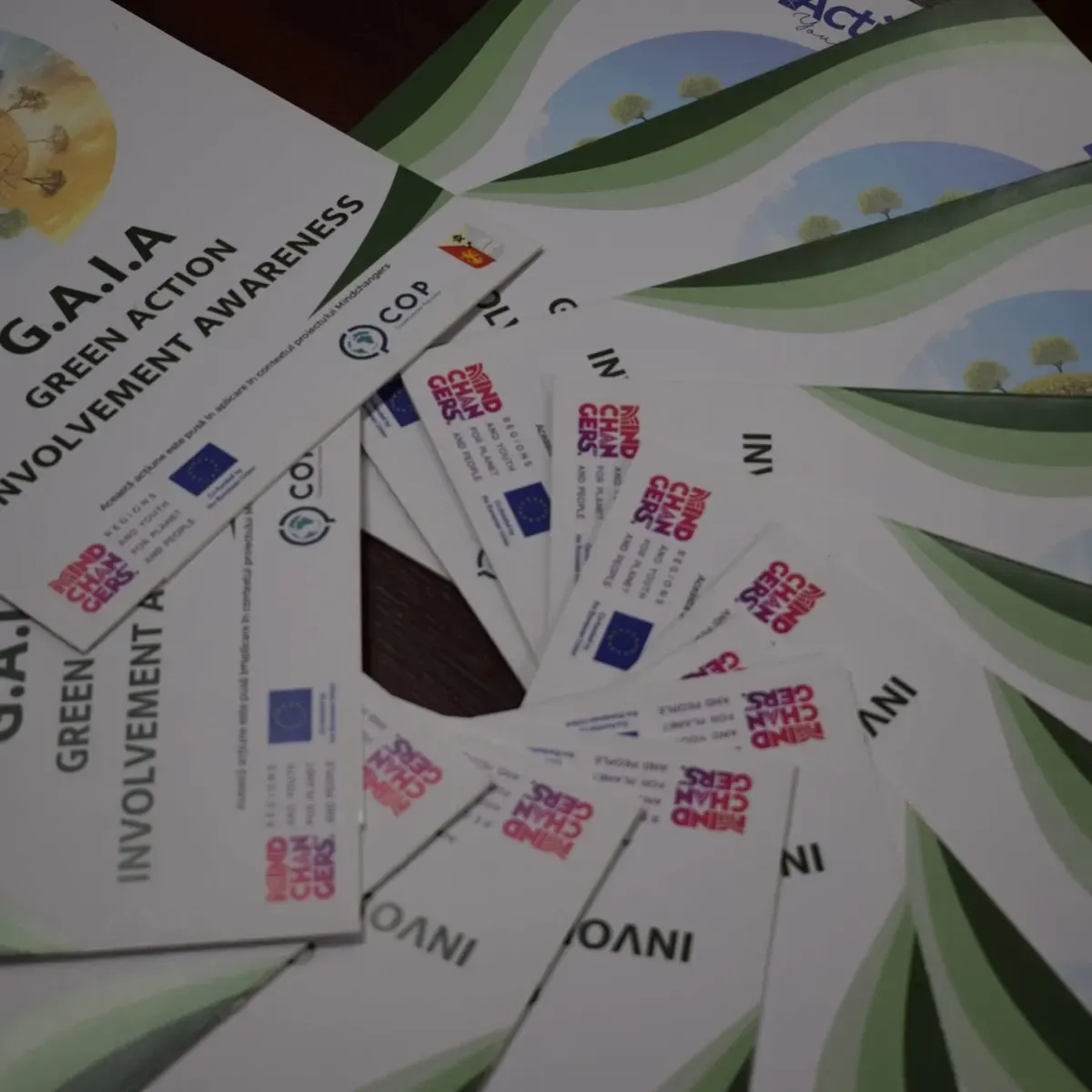 GAIA and Mindchangers leaflets fanned out on a table