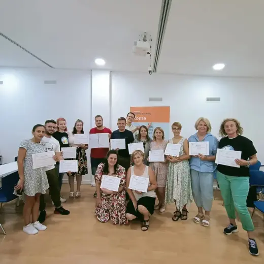 Course participants receiving their certificates